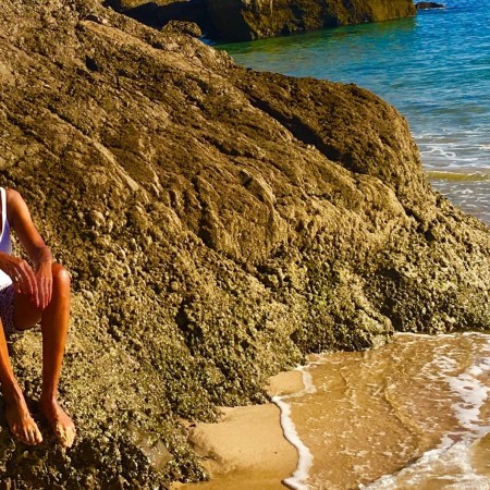 solo female traveler alone on beach